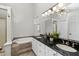 A spacious bathroom with double sinks, granite countertops, and a large soaking tub at 3253 Strathmore Dr, Duluth, GA 30096