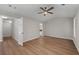 Spacious bedroom features a ceiling fan, wood flooring, and access to a connected bathroom at 3253 Strathmore Dr, Duluth, GA 30096