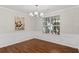 Elegant dining room with decorative moldings, chandelier, and large window at 3253 Strathmore Dr, Duluth, GA 30096