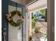 A welcoming front door with a wreath offering a glimpse of the home's well-kept exterior at 3253 Strathmore Dr, Duluth, GA 30096