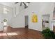Spacious living area with hardwood floors, high ceilings, and seamless flow to the kitchen at 3253 Strathmore Dr, Duluth, GA 30096