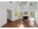 Bright living room with a fireplace, wood floors, high ceilings, and large windows at 3253 Strathmore Dr, Duluth, GA 30096