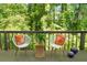 Outdoor patio featuring chairs and a table, surrounded by lush greenery at 3253 Strathmore Dr, Duluth, GA 30096