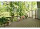 Outdoor patio featuring chairs and a table, surrounded by lush greenery at 3253 Strathmore Dr, Duluth, GA 30096