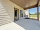 Covered back porch with an exterior door, windows, and a view of the backyard at 3132 Rosebud Rd, Loganville, GA 30052