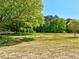 Spacious back yard perfect for outdoor activities and entertaining, backed by lush trees at 3132 Rosebud Rd, Loganville, GA 30052
