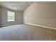 Carpeted bedroom with high ceilings and natural light from the window at 3132 Rosebud Rd, Loganville, GA 30052