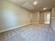 Spacious bonus room offers plush carpet, neutral color, ample natural light and great access at 3132 Rosebud Rd, Loganville, GA 30052