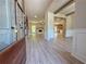 Inviting entryway showcasing open floor plan, light gray plank flooring, and a view into the living area at 3132 Rosebud Rd, Loganville, GA 30052