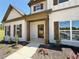 Charming new construction home featuring a covered front porch with dark wood accents at 3132 Rosebud Rd, Loganville, GA 30052