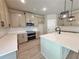 New kitchen featuring stainless appliances, quartz countertops, shaker cabinets, and stylish pendant lights at 3132 Rosebud Rd, Loganville, GA 30052