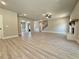 Open-concept living room featuring lots of floor space, a ceiling fan, and stairs to the second floor at 3132 Rosebud Rd, Loganville, GA 30052