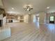 Large open concept living space flows into the modern kitchen and dining area at 3132 Rosebud Rd, Loganville, GA 30052