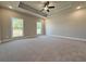 New main bedroom featuring two windows, carpet floors, a ceiling fan, and a trey ceiling at 3132 Rosebud Rd, Loganville, GA 30052