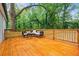 Spacious wooden back deck with comfortable seating, perfect for outdoor relaxation and entertaining guests at 3566 Orchard Dr, Decatur, GA 30032