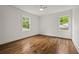 Bright bedroom with hardwood floors, natural light, and ceiling fan at 3566 Orchard Dr, Decatur, GA 30032