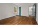 Bright bedroom with hardwood floors and ensuite bathroom featuring modern finishes and natural light at 3566 Orchard Dr, Decatur, GA 30032