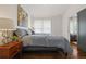 Cozy bedroom featuring hardwood floors, a comfortable bed, and stylish decorations at 3566 Orchard Dr, Decatur, GA 30032