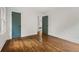 Spacious bedroom featuring hardwood floors and modern doors leading to other rooms at 3566 Orchard Dr, Decatur, GA 30032