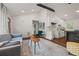 Inviting living space seamlessly flowing into kitchen, featuring hardwood floors and modern decor throughout at 3566 Orchard Dr, Decatur, GA 30032