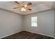 Cozy bedroom featuring wood flooring, a ceiling fan, and plenty of natural light at 39 Spring Leaf Pl, Dallas, GA 30157