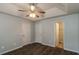 Comfortable bedroom with tray ceiling, ceiling fan, and an ensuite bathroom at 39 Spring Leaf Pl, Dallas, GA 30157