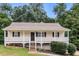Charming single-story home with a welcoming front porch and a well-maintained yard at 39 Spring Leaf Pl, Dallas, GA 30157
