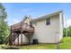 Exterior elevation showcases a charming home with a wooden deck and stairs at 39 Spring Leaf Pl, Dallas, GA 30157