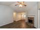 Inviting living area with hardwood floors, a stone fireplace, and natural light at 39 Spring Leaf Pl, Dallas, GA 30157