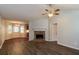 Spacious living room featuring a cozy fireplace, ceiling fan, and modern flooring at 39 Spring Leaf Pl, Dallas, GA 30157