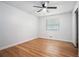 Empty bedroom with hardwood floors, ceiling fan and ample closet space at 4807 Kenilworth Dr, Stone Mountain, GA 30083