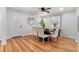 Charming dining room featuring hardwood floors, modern light fixture and ample natural light at 4807 Kenilworth Dr, Stone Mountain, GA 30083