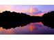 Scenic lake view with captivating sunset reflected on the water, creating a serene and picturesque setting at 4807 Kenilworth Dr, Stone Mountain, GA 30083
