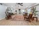 Inviting living room features a fireplace, wood floors, decorative rug, and stylish seating at 4807 Kenilworth Dr, Stone Mountain, GA 30083