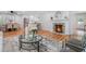 Open floor plan featuring a living room with fireplace, dining area, and modern kitchen at 4807 Kenilworth Dr, Stone Mountain, GA 30083