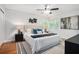Comfortable main bedroom with large bed, ceiling fan, and natural light at 4807 Kenilworth Dr, Stone Mountain, GA 30083