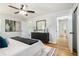Spacious main bedroom with hardwood floors, closet, and dresser at 4807 Kenilworth Dr, Stone Mountain, GA 30083