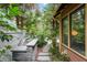 Outdoor kitchen area with built-in grill, concrete countertop, and lush greenery at 171 Westminster Ne Dr, Atlanta, GA 30309