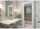 Elegant bathroom with marble countertop sink, subway tile, and walk-in shower at 171 Westminster Ne Dr, Atlanta, GA 30309