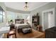 Cozy bedroom with bay windows, plush bedding, and decorative shelving at 171 Westminster Ne Dr, Atlanta, GA 30309