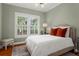 Comfortable bedroom featuring a decorative window and neutral tones at 171 Westminster Ne Dr, Atlanta, GA 30309