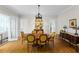 Elegant dining room with hardwood floors, a round wooden table, and decorative chandelier at 171 Westminster Ne Dr, Atlanta, GA 30309