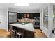 Modern kitchen featuring stainless steel appliances, a central island with seating, and ample counter space at 171 Westminster Ne Dr, Atlanta, GA 30309