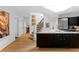 Open kitchen featuring a large island, stainless steel appliances, and seamless access to the staircase at 171 Westminster Ne Dr, Atlanta, GA 30309