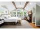 Vaulted ceiling main bedroom with fireplace, large windows, and carpeted floors at 171 Westminster Ne Dr, Atlanta, GA 30309