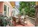 Charming side porch featuring outdoor dining table and chairs at 171 Westminster Ne Dr, Atlanta, GA 30309