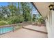 Wood deck overlooking a serene backyard with mature trees and a pristine swimming pool at 2779 Fairlee Dr, Decatur, GA 30032