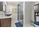 Bathroom boasting white marble floors, glass enclosed shower and modern vanity sink at 2779 Fairlee Dr, Decatur, GA 30032