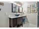 Bathroom featuring a modern sink and dark wood vanity with a decorative mirror at 2779 Fairlee Dr, Decatur, GA 30032