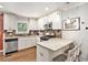Well-appointed kitchen offers granite countertops, updated appliances, and a breakfast bar with seating at 2779 Fairlee Dr, Decatur, GA 30032
